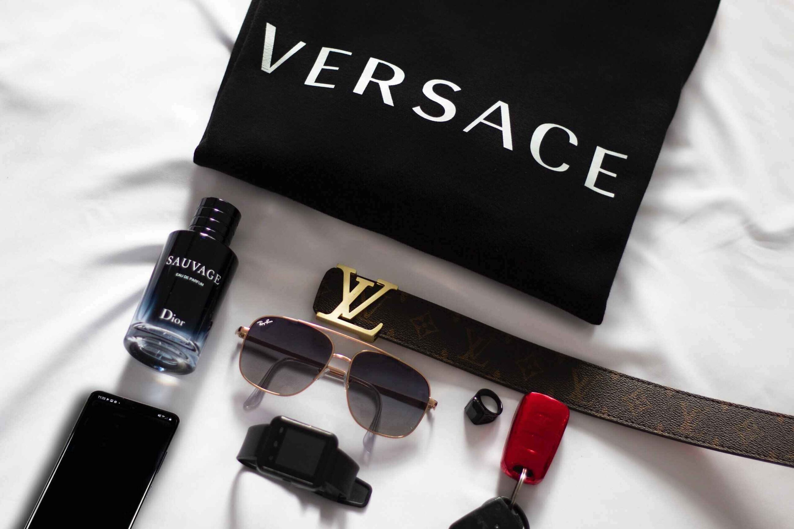 luxury goods laid out on a bed